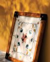 NOSTALGIA AND CRAFT COME TOGETHER IN SHED'S NEWEST PIECE: A CARROM BOARD MADE WITH MARBLE INLAY AND MINIATURE-PAINTING-STYLE DRAWINGS. AD Architectural Digest India