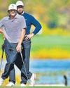 Tiger and Charlie hit five straight birdies, share lead