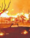 Thousands flee as wildfires sweep LA