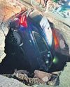 Car falls in Dwarka service road cave-in