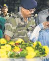 Grief, resolve mark tearful farewells Grief, resolve mark tearful farewells