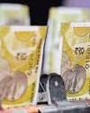 Rupee slides to record low on global jitters, outlook fragile28