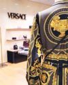 Prada Looks to Bag Versace from Capri