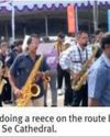 100-member brass band to tail carriage of St Xavier's relics