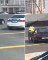 Police officer, citizen help woman after car breaks down11