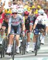 Philipsen wins nervy Tour de France opener as Evenepoel loses time55