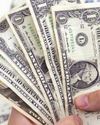Dollar firms as traders pare rate cut bets52
