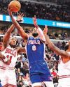 White scores 13 points as Bulls rally to beat 76ers, Pistons lose74