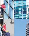 Climber scales Taipei 101 skyscraper without ropes Climber scales Taipei 101 skyscraper without ropes24