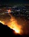 Los Angeles firefighters battle wildfires as communities burn