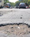 Bad roads, garbage mounds welcome visitors at industrial estate in Guindy