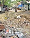 Approach road to Kilpauk cemetery in a shambles