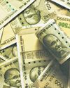 Rupee hits record lows; closes at 87.18/dollar despite RBI support