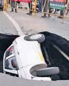 Case booked over sinkhole that 'swallowed' car Case booked over sinkhole that 'swallowed' car