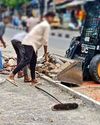 No safety gear for workers clearing construction debris9
