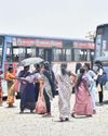 Bereft of cover, people face the elements at Redhills bus stand18