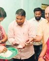 Collector has meals with students to check food quality