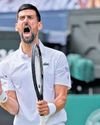 Djokovic battles back to keep record chase alive63