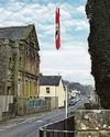 Nazi symbol flag hoisted near church