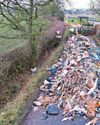 Homes blocked by 40ft rubbish dump