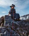 Scaling Mont Blanc wearing a bonnet, vintage pantaloons and a feather boa!