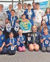 Harrison wins gold hat-trick at County swim meet22