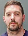 Man jailed after hitting 'smiling' police officer0