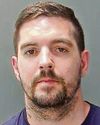 Man jailed after hitting 'smiling' police officer0