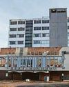 Police warning after people found on building rooftop Police warning after people found on building rooftop