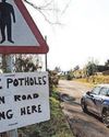 Dangerous pothole sees car written off12