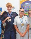 'So grateful' Teen swimming champ returns to hospital to thank medics 'So grateful' Teen swimming champ returns to hospital to thank medics3