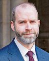 Business secretary urged to delay China trip Business secretary urged to delay China trip