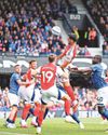 Gunners' win puts Reds' title celebration on hold Gunners' win puts Reds' title celebration on hold