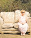 Portrait of girl on 'stinky' dumped sofa wins award1