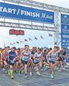 Running festival shuts roads as thousands pound the streets Running festival shuts roads as thousands pound the streets