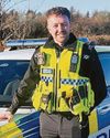 Officer rescues driver trapped in car blaze1