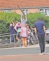 Chaos erupts on quiet street as families brawl with weapons12