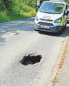 Hole lot of trouble as road sinks Hole lot of trouble as road sinks1
