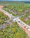 FAMILIES' 'NIGHTMARE' OF LIVING IN VILLAGE CARVED IN TWO BY HS219