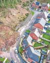 FAMILIES FUME AT HOMES PLAN ON LANDSLIP ESTATE Sunday Mercury
