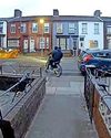HOUSE IS TORCHED BY SCRAMBLER BIKE PAIR0