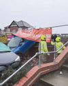 Chaos as car goes through wall and hits vehicle2