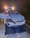 Man charged after Porsche crashes into rail bridge13