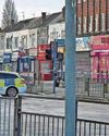 Police hunt 'fifth victim' after four slashed in street Police hunt 'fifth victim' after four slashed in street0