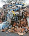 Charges over mountain of industrial waste left on road0