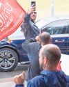 King gives a wave to striking bin workers9