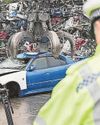 Loved ones look on as 'killer car' is crushed Loved ones look on as 'killer car' is crushed3