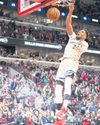 Giannis wins on return, Spurs streak ends27