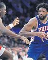 Embiid triple-double powers Philadelphia32