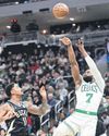 Celtics rout Bucks, Mavs teen Flagg makes history Celtics rout Bucks, Mavs teen Flagg makes history25